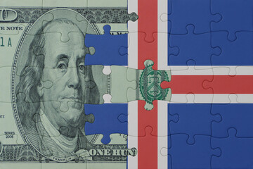 puzzle with the national flag of iceland and dollar money banknote. macro.concept.