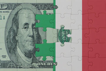 puzzle with the national flag of italy and dollar money banknote. macro.concept.