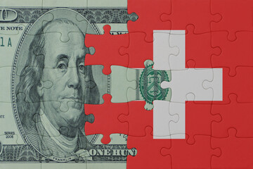 puzzle with the national flag of switzerland and dollar money banknote. macro.concept.