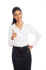 Successful young business woman showing thumbs up isolated on white.