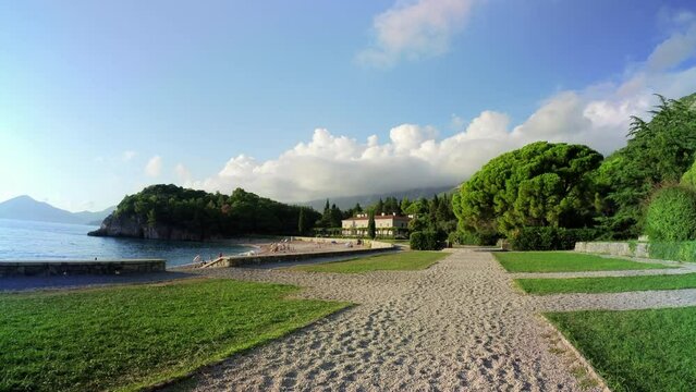 SVETI STEFAN, MONTENEGRO - SEPTEMBER 18, 2021: Milocer Park in Sveti Stefan - 4K, Ultra-wide shot, Walk