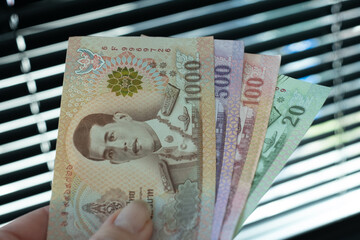 Thai baht banknotes. Cash money of Thailand. Thai economy and financial system concept.