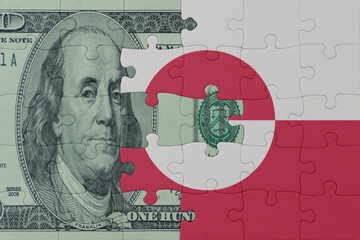puzzle with the national flag of greenland and dollar money banknote. macro.concept.