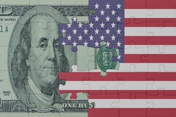 puzzle with the national flag of united states of america and dollar money banknote. macro.concept.