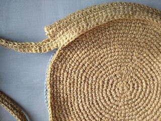 Beach bag made of blue and beige jute, crocheted