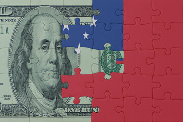 puzzle with the national flag of Samoa and dollar money banknote. macro.concept.