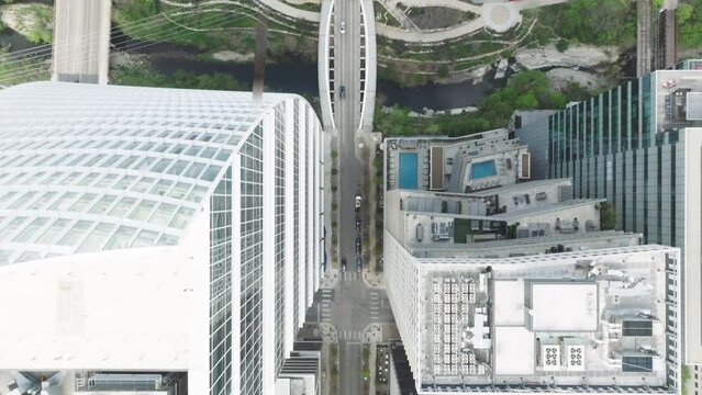 AUSTIN TEXAS USA. Tower tops within busy streets of Austin downtown on sunny summer day in urban cityscape. Aerial view of skyscrapers with walls composed of clear glass with pearlescent metal accents