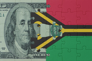 puzzle with the national flag of and dollar money banknote. macro.concept.