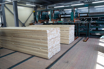 A factory for sawing logs into boards.Timber products warehouse on a specialized site.