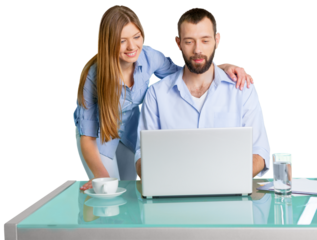 Young Couple Using Laptop On Desk
