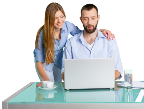 Young Couple Using Laptop On Desk
