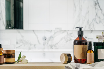 Collection of beauty products with recycled brown glass in bathroom