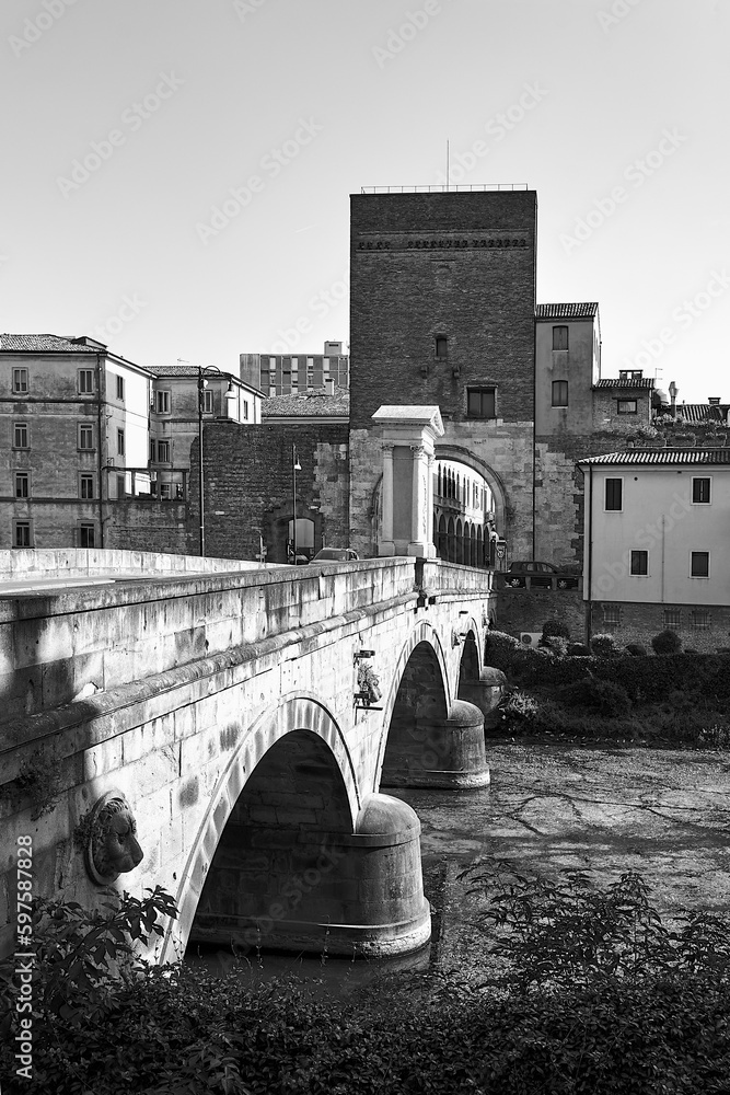 Wall mural Stone bridge on Bacchiglione river and historic tower with gate in Padua city