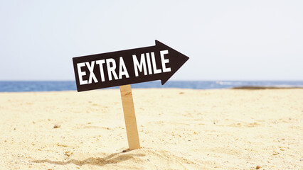 Go the extra mile is shown using the text on the road sign - obrazy, fototapety, plakaty