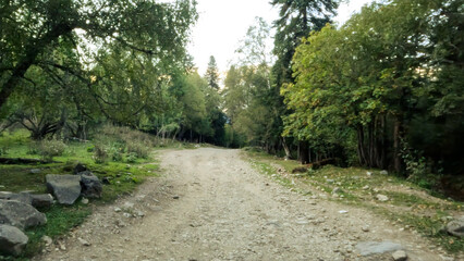 Obraz premium mountain ridge rough backpacking dirty road with no asphalt - photo of nature