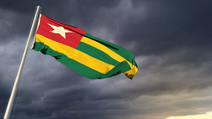 beautiful Togo flag on heavy dark clouds bg - abstract 3D illustration