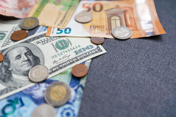 Business and finance concept. Monetary background. US and EU banknotes and coins, Paper dollars, euros and coins scattered in chaotic order. Business and finance concept