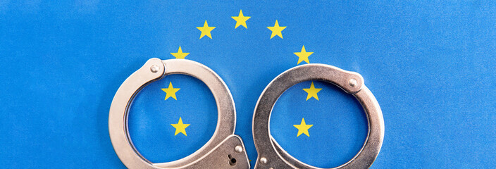 handcuffs on European flag