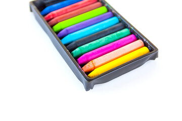 Fototapeta premium Colored crayons on paper background.