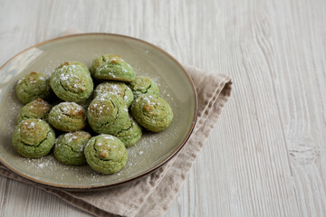 Homemade Soft Amaretti Cookies with Pistachio on a Plate, side view. Copy space.