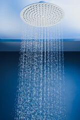 water drops falling from large rain shower head