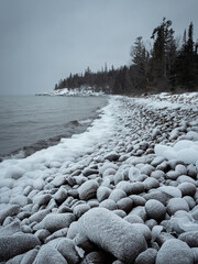 Rocks covered with ice on a cold winter day along the shore of lake Superior