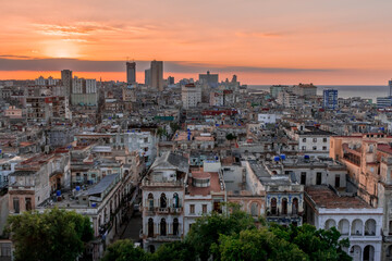 View over the rooftops of Havana in Cuba at sunset with the El National hotel