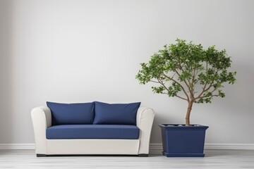 potted tree next to a blue and white couch. Generative AI