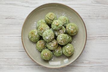 Homemade Soft Amaretti Cookies with Pistachio on a Plate, top view. Flat lay, overhead, from above.