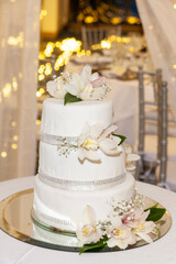 Obraz na płótnie Canvas Social Event; Tasty Wedding Cake Decorated With Flowers.