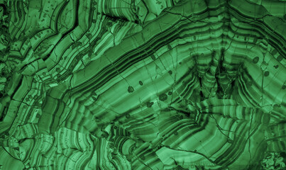 Malachite is a green mineral gemstone texture. Semiprecious ornamental stone malachite. green background