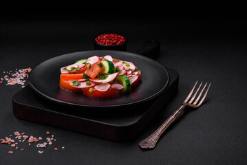 Delicious vegan salad of fresh vegetables of tomatoes, cucumbers and radishes