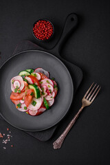 Delicious vegan salad of fresh vegetables of tomatoes, cucumbers and radishes
