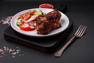 Delicious nutritious dish consisting of grilled chicken legs with a salad