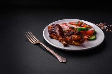 Delicious nutritious dish consisting of grilled chicken legs with a salad