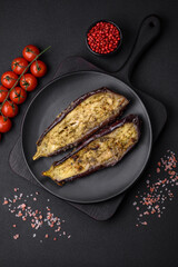 Delicious eggplant cut into two halves baked with salt, spices and herbs