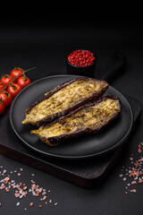 Delicious eggplant cut into two halves baked with salt, spices and herbs