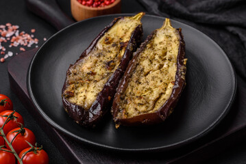 Delicious eggplant cut into two halves baked with salt, spices and herbs