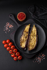 Delicious eggplant cut into two halves baked with salt, spices and herbs
