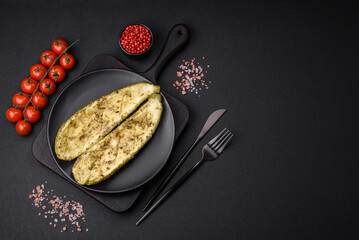 Delicious zucchini cut into two halves baked with salt, spices and herbs