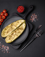 Delicious zucchini cut into two halves baked with salt, spices and herbs