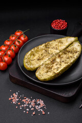 Delicious zucchini cut into two halves baked with salt, spices and herbs
