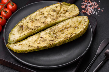 Delicious zucchini cut into two halves baked with salt, spices and herbs