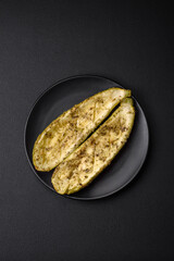 Delicious zucchini cut into two halves baked with salt, spices and herbs
