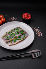 Delicious Atlantic herring marinated with salt and spices