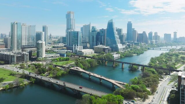 Financial and residential buildings cityscape view on sunny summer day, 4K footage USA. Austin Texas USA aerial drone footage of Colorado river parks with Downtown skyscrapers on cinematic background