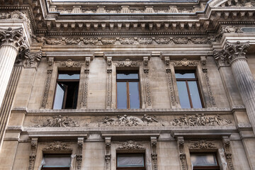 Architectural fragment of Brussels Stock Exchange building (BeursBourse) on the Place de la Bourse. The building erected from 1868 to 1873 in the Neo-Renaissance style. Brussels, Belgium.