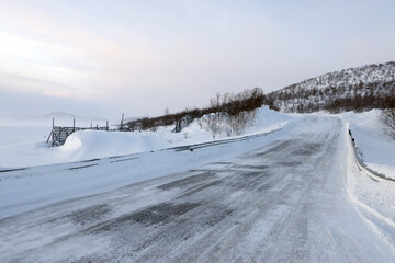 Stormy windy winter conditions on the road in Lapland, Enontekio, Finland, Europe