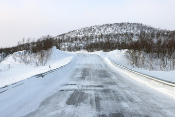 Stormy windy winter conditions on the road in Lapland, Enontekio, Finland, Europe