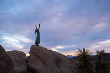 Senior Woman in the desert expressing wellness and heath. 